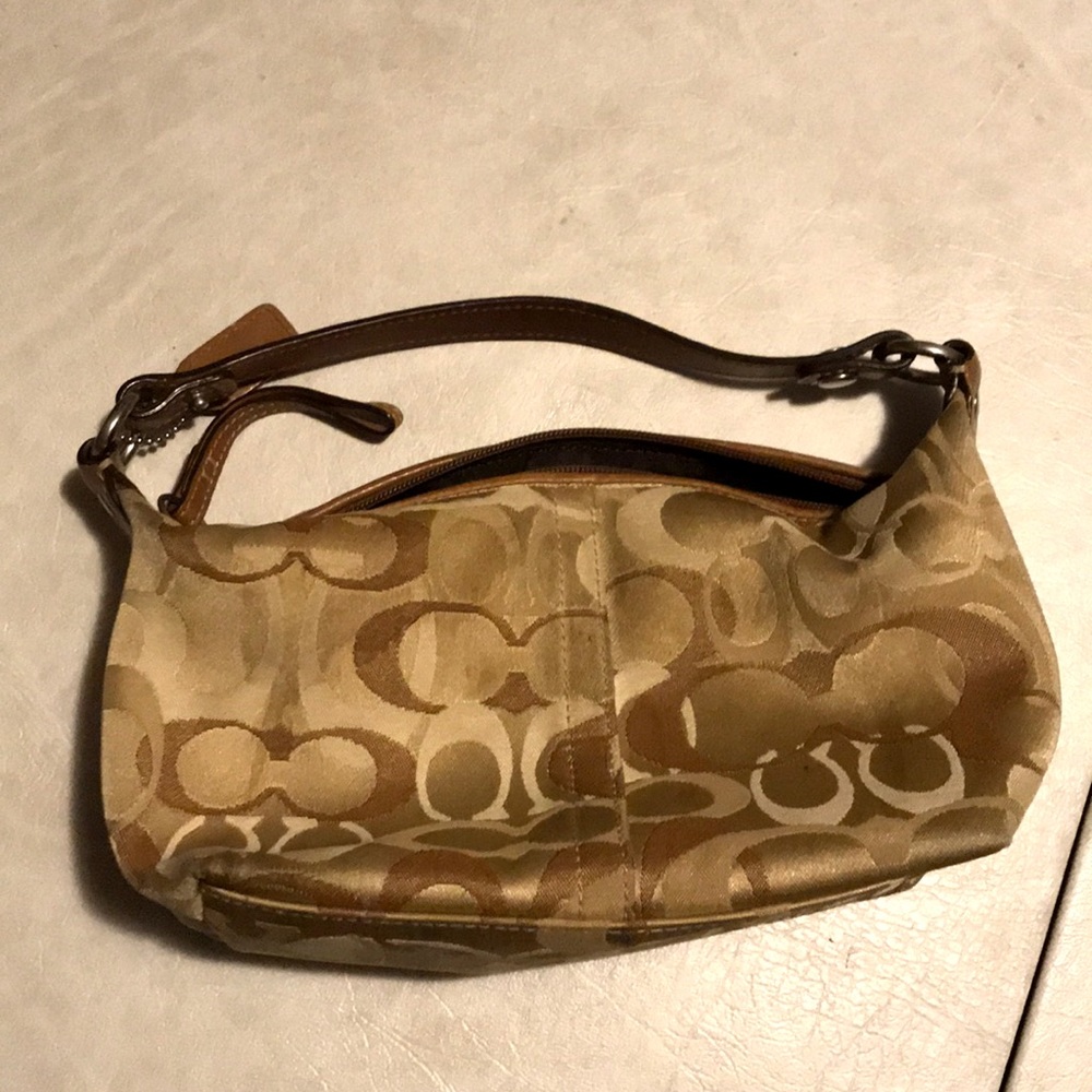 A brown coach bag